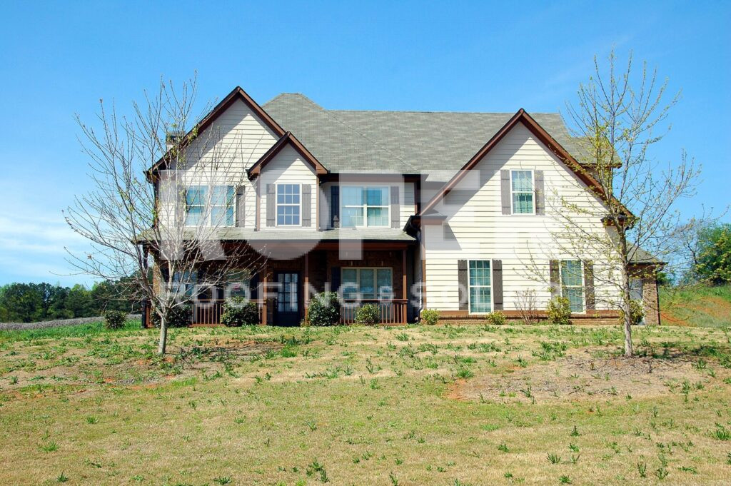 Modern two-story suburban house with white siding and covered front porch