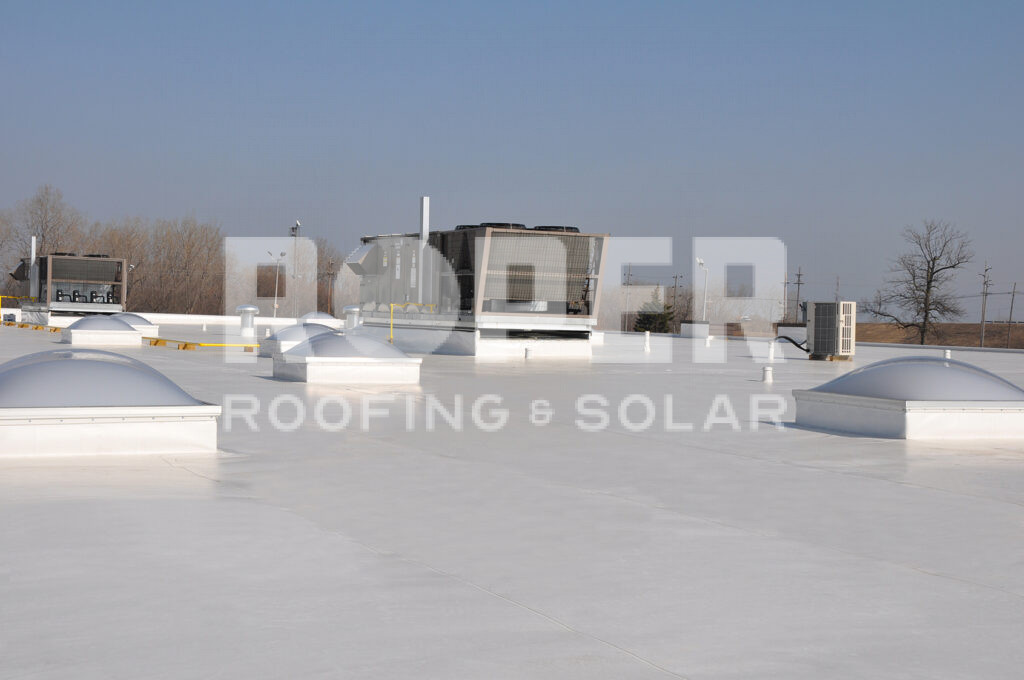Commercial flat roof with HVAC units and roofing & solar overlay text