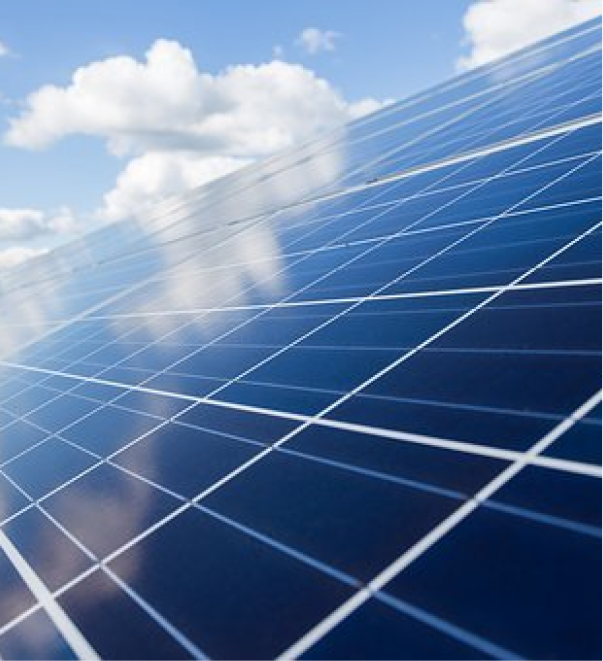 Blue solar panels against cloudy sky for renewable energy generation