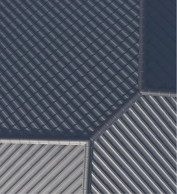 Gray tiled roof sections with diagonal patterns viewed from above