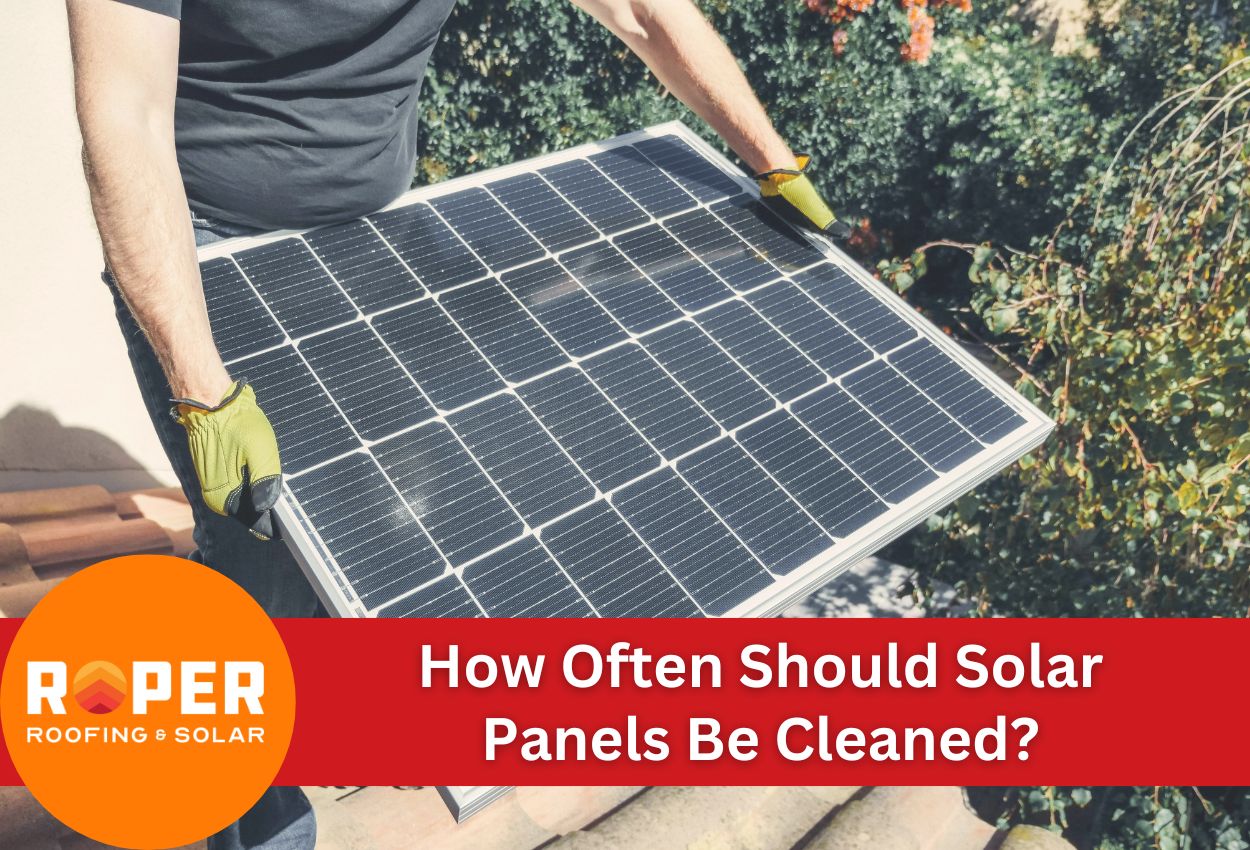 man holding solar panel