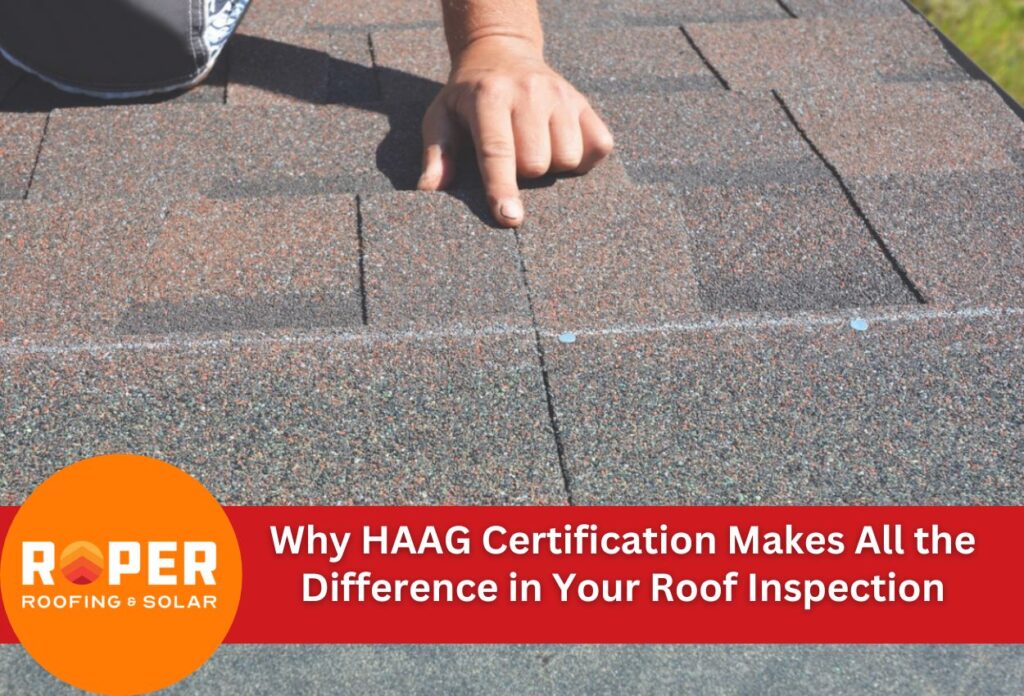 Hand pointing at roof shingles during professional inspection by HAAG certified inspector