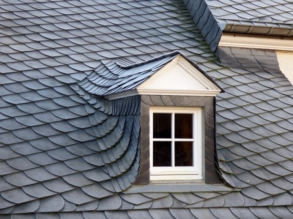 grey slate roof on house with square window