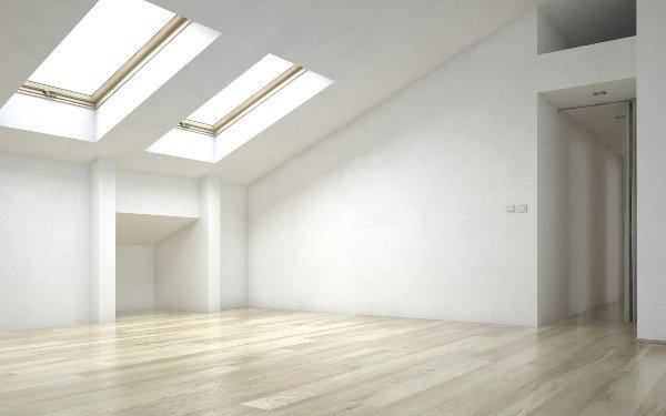 two skylight units lighting up dark and empty room